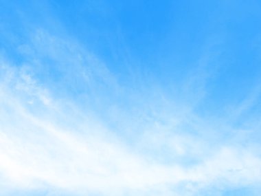 Küçük bulutlu mavi gökyüzü arkaplanı.