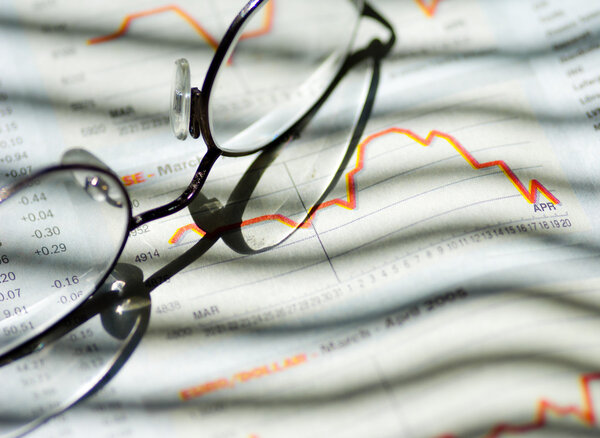 Financial paper and glasses