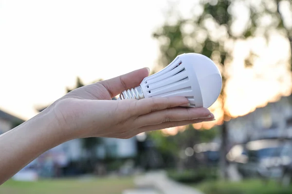 LED Bulb - saving technology in our hand — Stock Photo, Image