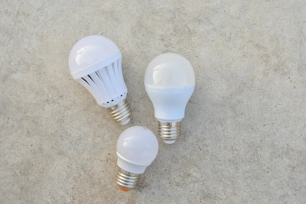 LED Bulbs on the white concrete — Stock Photo, Image