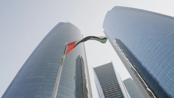 Uae flag on skyscraper background — Stock Video