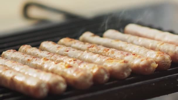 Grill sausages roast on grid — Stock Video