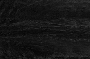 Siyah kaya arka planı. Koyu gri taş dokusu. Siyah grunge geçmişi. Dağ yakın çekim. Üzücü arkaplan.