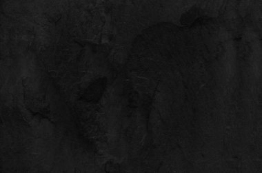 Siyah grunge geçmişi. Kaya arka planı. Dağların dokusu. Yakın plan. Siyah hacimli taş arkaplan.