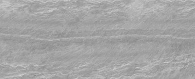 Taş duvarın panorama koyu gri dokusu. Yakın plan. Açık gri kaya arkaplanı.