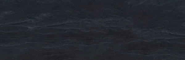 Dark grey black slate background or texture for wallpaper decorative design.