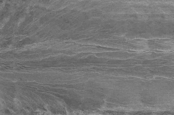 Black and white background. Gray rock texture. Grunge stone background. The texture of the mountains. Close-up. Grunge banner with volumetric rock texture.