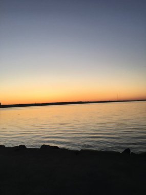 Sunset on the bank of the highmountain lake