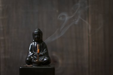 Smoking Buddha Incense Holder clipart