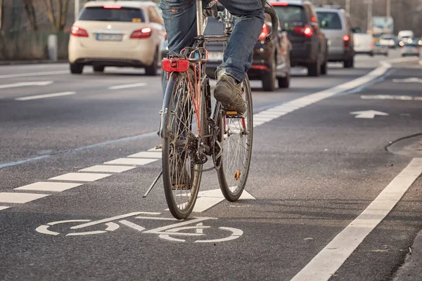 cyclist on bike lane in the city