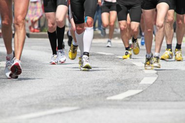 group of marathon runners on the road clipart