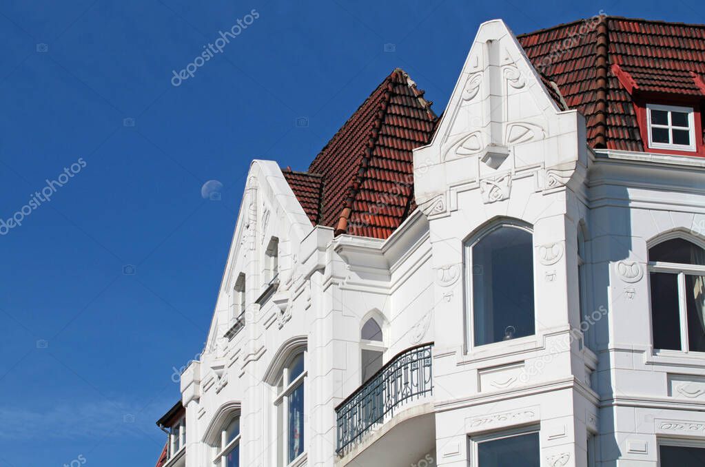attic of art nouveau building with red roof tiles