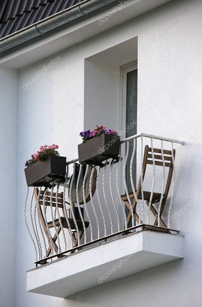 tiny balcony with chairs