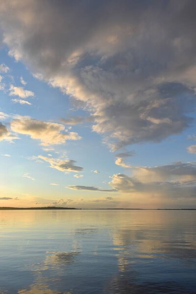 Sunset clouds and calm river