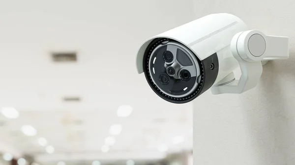Security CCTV camera on blurred office background. Surveillance and Security concept, 3D Render.