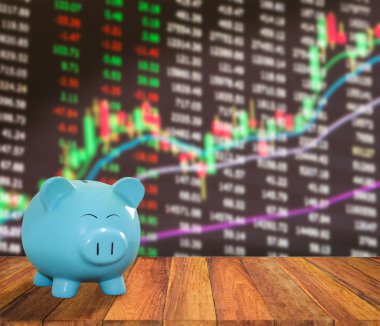 ahşap zemin üzerine mavi domuz banka bulanıklık borsa backgrou