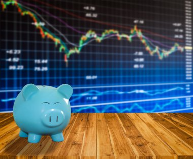 ahşap zemin üzerine mavi domuz banka bulanıklık borsa backgrou