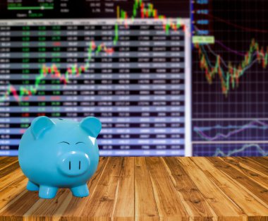ahşap zemin üzerine mavi domuz banka bulanıklık borsa backgrou