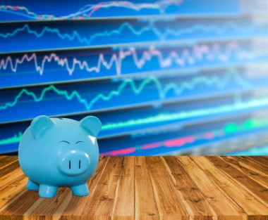 ahşap zemin üzerine mavi domuz banka bulanıklık borsa backgrou