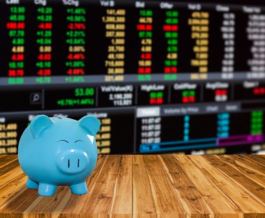 ahşap zemin üzerine mavi domuz banka bulanıklık borsa backgrou