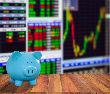 ahşap zemin üzerine mavi domuz banka bulanıklık borsa backgrou