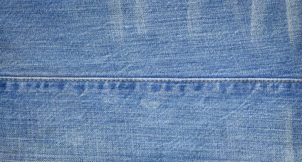 Närbild av denim jeans textur med sömmar — Stockfoto