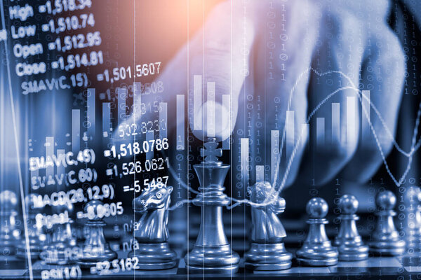 Chess game on chess board behind business man background. Business concept to present financial information and marketing strategy analysis. Investment target in global economy and digital commercial.