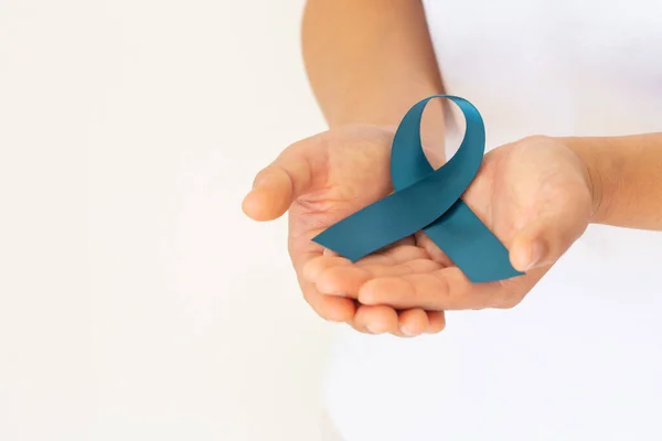 Hand Holding Teal Color Ribbon White Background Copy Space Ovarian — Φωτογραφία Αρχείου