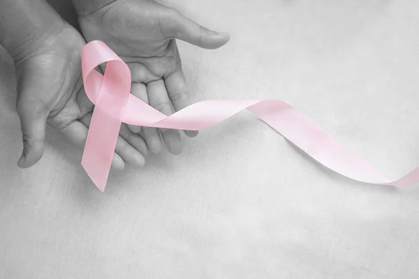 Hands Holding Pink Ribbon Curl White Isolated Fabric Copy Space — Stock Photo, Image