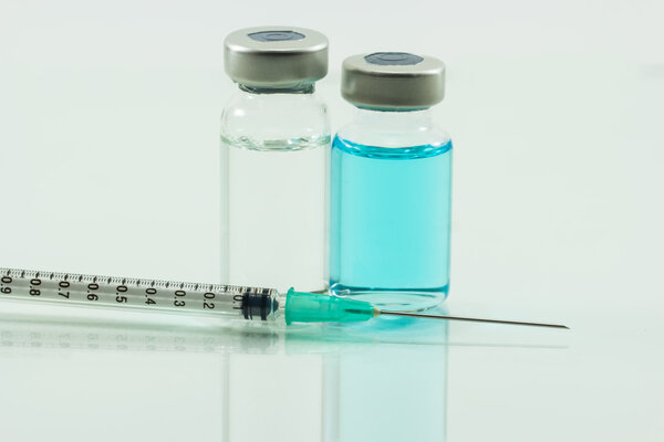 medical syringe and medicine  isolated on white background
