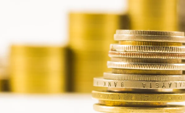 Golden coins and coins stacked on each other in different positi — Stock Photo, Image