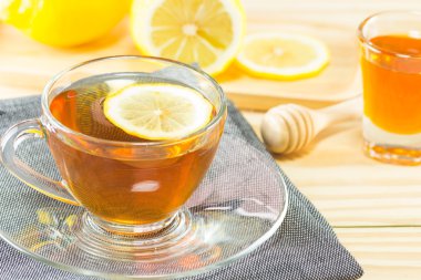 Bal ve limon ahşap arka plan, sıcak tonlama, seçileceği yer ile çay