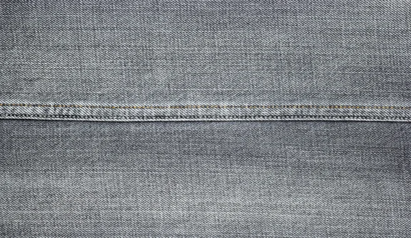 Närbild av denim jeans textur med sömmar — Stockfoto