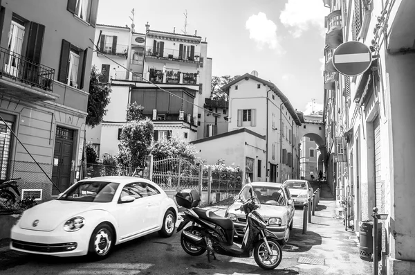 italy white beetle car narrow street drive bologna black and white