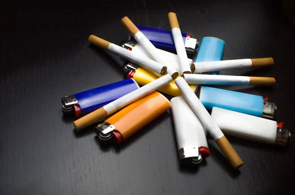 Lighters and cigarettes - smoke background — Stock Photo, Image