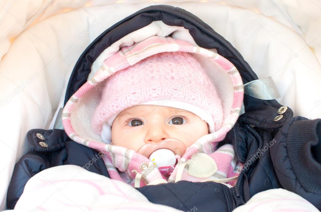 baby dressed for winter in the stroller