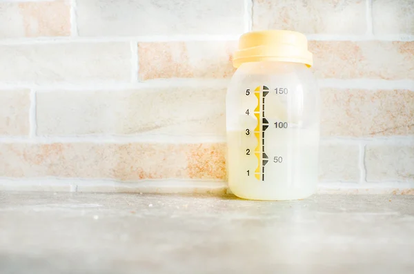 Breast milk bottle - newborn organic feeding — Stock Photo, Image