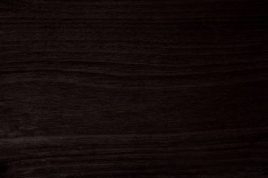 Koyu kahverengi ahşap, pürüzlü bir yüzeyi var.