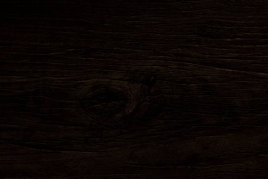 Koyu kahverengi ahşabın yüzey doğasında doku ve arka plan için ahşap gözü vardır.