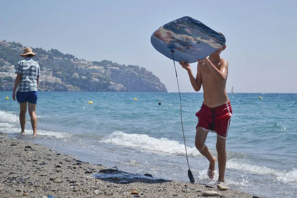 Boy Coming Out Sea Surfboard Surrounded Other Bathers Surfboards Sails — Stock Photo, Image