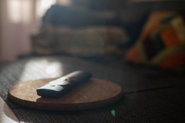 TV remote on the table in the morning