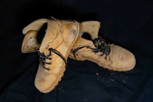 Old boots that have been worn for nine years.