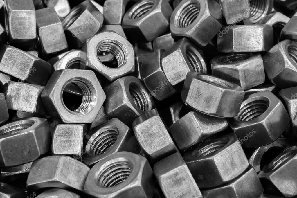 Metal bolt, nut and screw for industrial background Stock Photo by