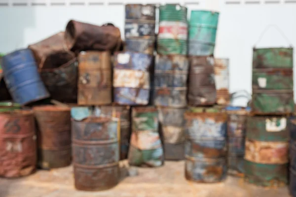 Defocused old oil or gasoline containers — Stock Photo, Image
