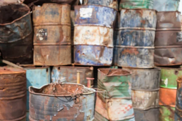 Defocused old oil or gasoline containers — Stock Photo, Image