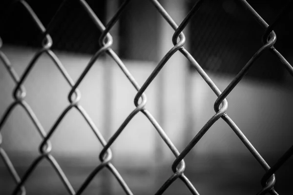 Abstract wire metal fence with blurry background — Stock Photo, Image