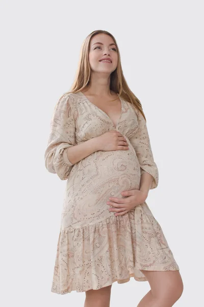 Smiling pregnant woman holding her belly — Stock Photo, Image