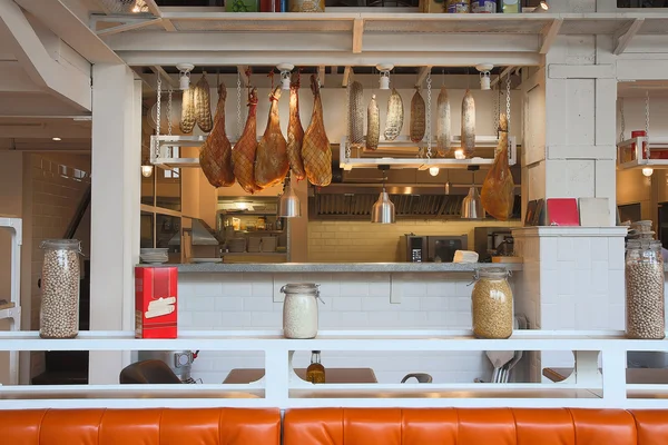 Hanging ham sausages and cereal counter cafe — Stock Photo, Image