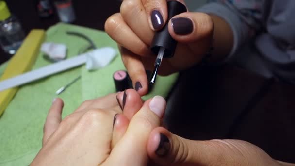 Woman doing manicure, hands close-up — Stock Video