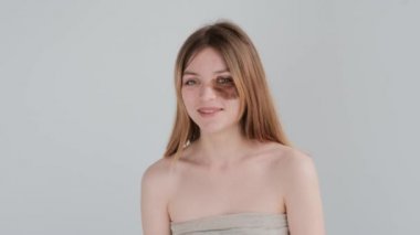 Young woman with birthmark on face